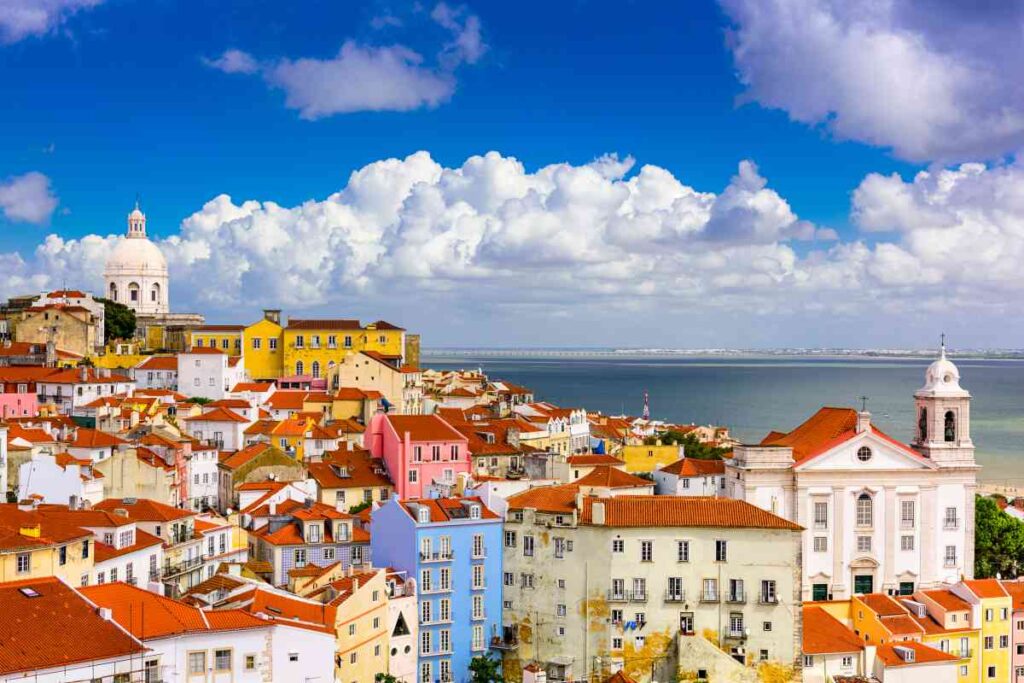 colorful buildings sitting on the hills of the alfama district of lisbon, portugal 