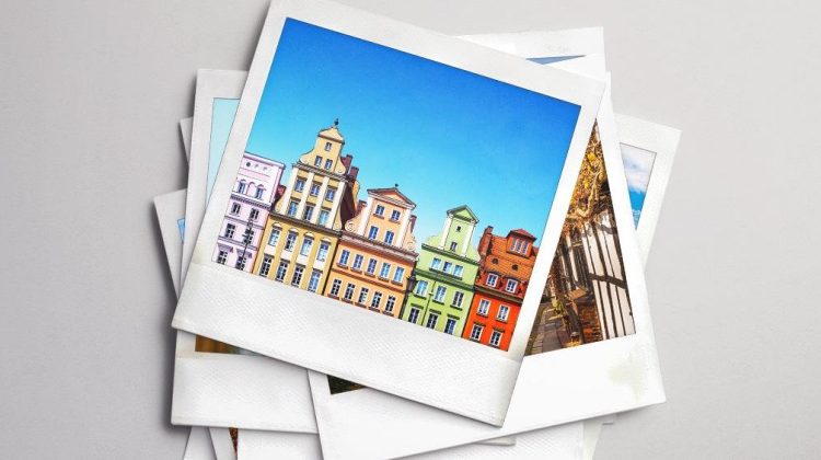 A stack of polaroid photos showing colourful townhouses in a whimsical European town.