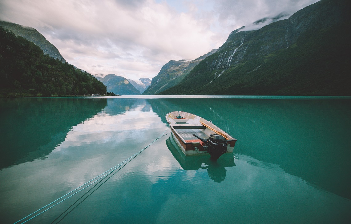 A view of Lovatnet lake with fjords rising around it